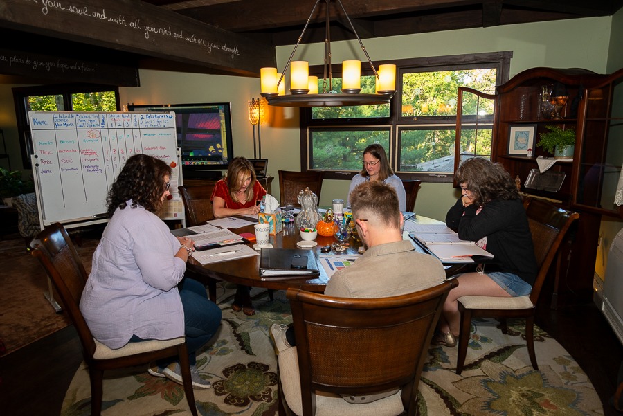 Heidi praying with group